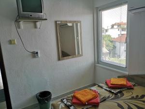 a room with a mirror and a bed with towels at Guestrooms Stoyanovi in Chernomorets +40 photos