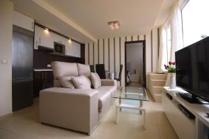 Telewizja i/lub zestaw kina domowego w obiekcie Apartamentos Fuerteventura Sol