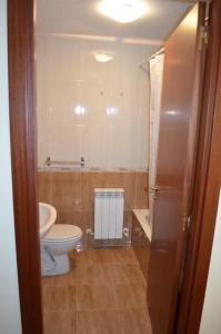 a bathroom with a toilet and a sink at Los Nietos in Briones