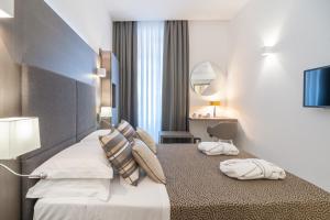 Posteľ alebo postele v izbe v ubytovaní Wellness Home Rome