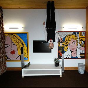 a person is jumping in the air in a room at HIP Hotel in Heidelberg