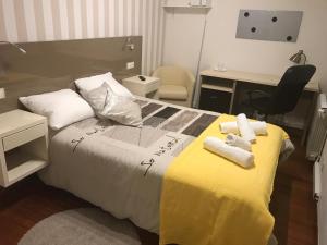 Posteľ alebo postele v izbe v ubytovaní Residencia Compostela