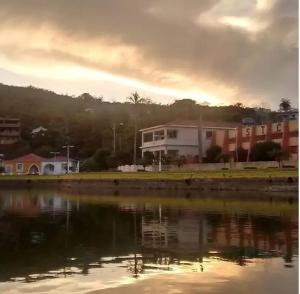 a building next to a body of water at Recanto do Lago Triunfo in Triunfo