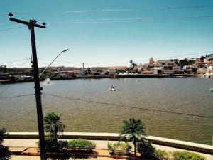 a view of a river with a boat in it at Recanto do Lago Triunfo in Triunfo