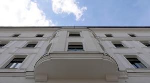 a white building with an arch in front of it at Lux 11 Berlin-Mitte in Berlin