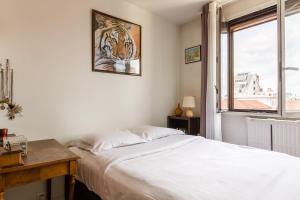 Ένα ή περισσότερα κρεβάτια σε δωμάτιο στο Veeve - Canal Saint Martin Pad