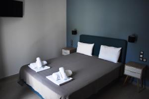 a hotel room with a bed and a desk at Christina Studios & Apartments in Parga