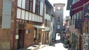 a city street filled with shops and buildings at Gîte ULTREIA Vertes Montagnes in Saint-Jean-Pied-de-Port