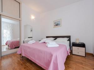 Cama o camas de una habitación en Apartments Dalmatia