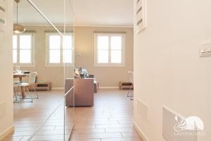 a view of a room with a table and chairs at Studio Apartment Il Pelèr in Toscolano Maderno +37 photos