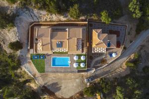 an aerial view of a building with a pool at Ble on Blue in Athanion