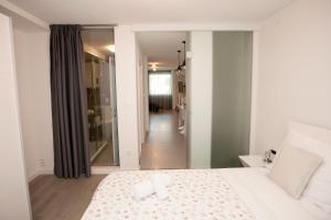 Posteľ alebo postele v izbe v ubytovaní Dream Apartment