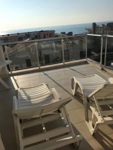 two chairs and a table on a balcony at Sun Village Villa 6 in Byala
