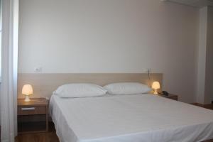 Postel nebo postele na pokoji v ubytování Hotel Gronda Lagunare
