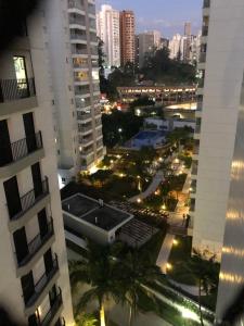 a view of a city at night from a building at Apartamento Top Morumbi in São Paulo