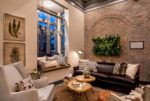 a living room with a brick wall at Hotel 1868 in Cambridge