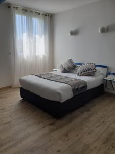 Postel nebo postele na pokoji v ubytování Hôtel Pédagogique Coeur d'Apcher
