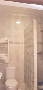 a bathroom with a toilet and a glass shower at Zacisze Konopnickiej in Pobierowo +43 photos