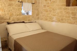 Posteľ alebo postele v izbe v ubytovaní B&B Giovannarolla Green House