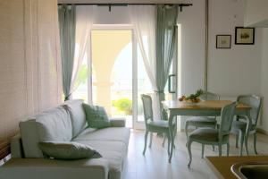 a living room with a couch and a table at Studio apartment Gray in Šibenik