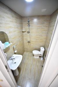 Koupelna v ubytování Orange Home Hotel