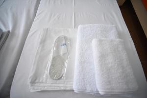 Postel nebo postele na pokoji v ubytování Orange Home Hotel