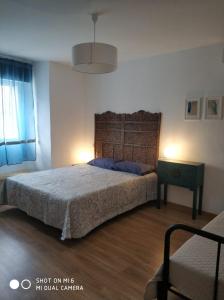 Ένα ή περισσότερα κρεβάτια σε δωμάτιο στο solaz del ambroz-Hervas