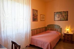 Posteľ alebo postele v izbe v ubytovaní Casa Donatella sulla costa degli Etruschi