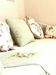 a group of pillows sitting on top of a bed at Villa Bridge in Potamia