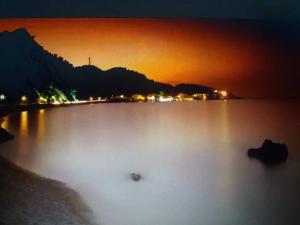 a view of a large lake at night at Abeas Samos Antonis 3 in Samos +2 photos