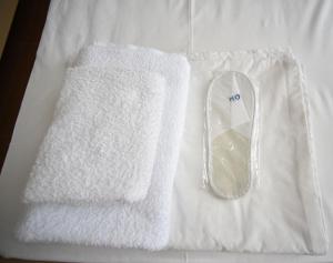 Postel nebo postele na pokoji v ubytování Orange Home Hotel