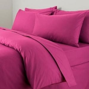 a bed with pink sheets and pillows at CASA CARGIA' HOLIDAYS in San Terenzo