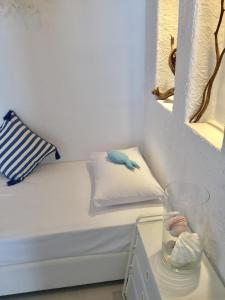 Cama ou camas em um quarto em Kyano House
