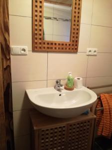 a bathroom with a sink and a mirror at Ferienhaus Flattnitz in Flattnitz