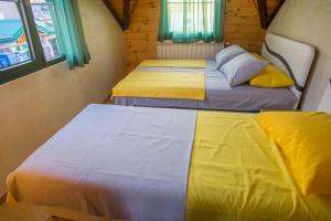 Postelja oz. postelje v sobi nastanitve Apartmani Restoran Durmitor