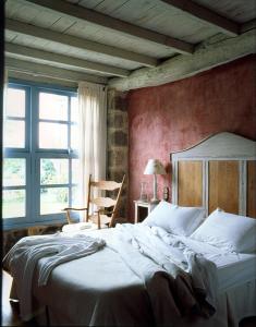A bed or beds in a room at Casa do Castelo de Andrade