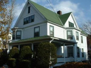 a large white house with a green roof at Wayne on Main in Honesdale
