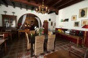 a dining room with a table and chairs at L'Auberge Catalane in Latour-de-Carol