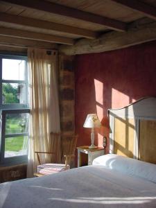 A bed or beds in a room at Casa do Castelo de Andrade