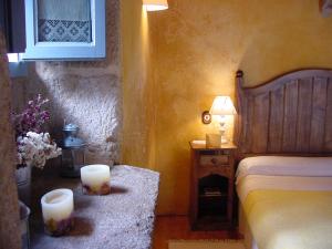 A bed or beds in a room at Casa do Castelo de Andrade
