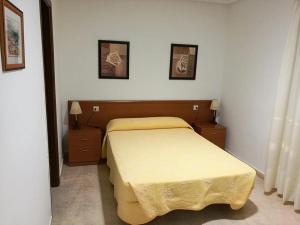 a bedroom with a bed and two night stands at PR As Termas in Bubaces