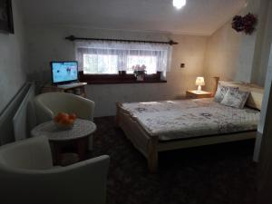 Una cama o camas en una habitación de Willa Katarzynka