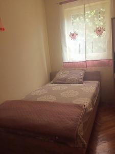 En eller flere senge i et værelse på Apartment Vista