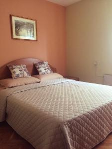 En eller flere senge i et værelse på Apartment Vista