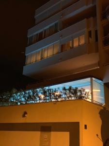 een gebouw met een balkon met planten erop bij Apartment Relax whit big terrace 170m2 Near the Beach in Split