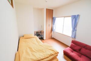 A bed or beds in a room at Saitama Niiza House / Vacation STAY 4274