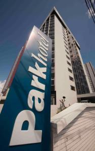 a hotel sign in front of a building at Park Hotel in Recife