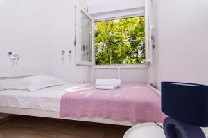 Posteľ alebo postele v izbe v ubytovaní Apartman Sun Solin