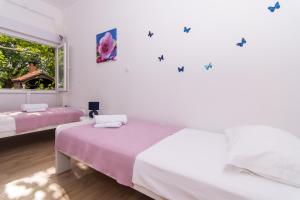 Posteľ alebo postele v izbe v ubytovaní Apartman Sun Solin
