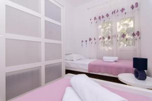 Кровать или кровати в номере Apartman Sun Solin